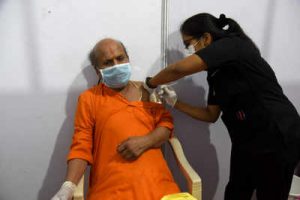 Indian man receives a vaccine shot.